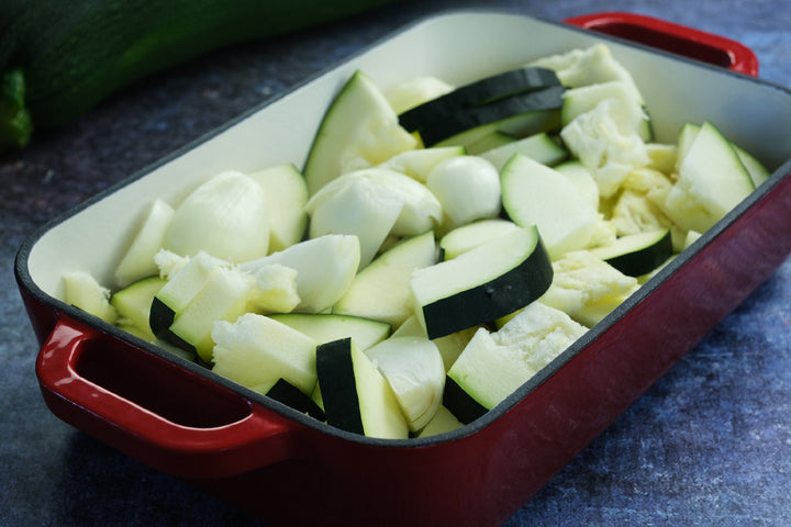 Enameled cast iron coasting pan baking dish from Crucible Cookware with zucchini and onion