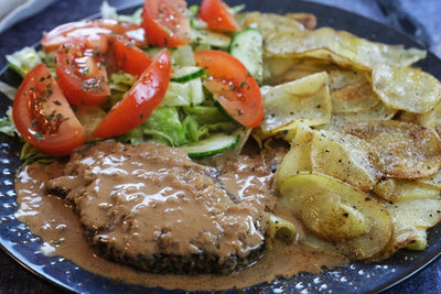 Butter Basted Pepper Steak with Fried Raw Potatoes and Red Wine Whiskey Sauce