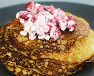 Potato Mini Pancakes in a Cast Iron Skillet with Cottage Cheese and Lingonberry