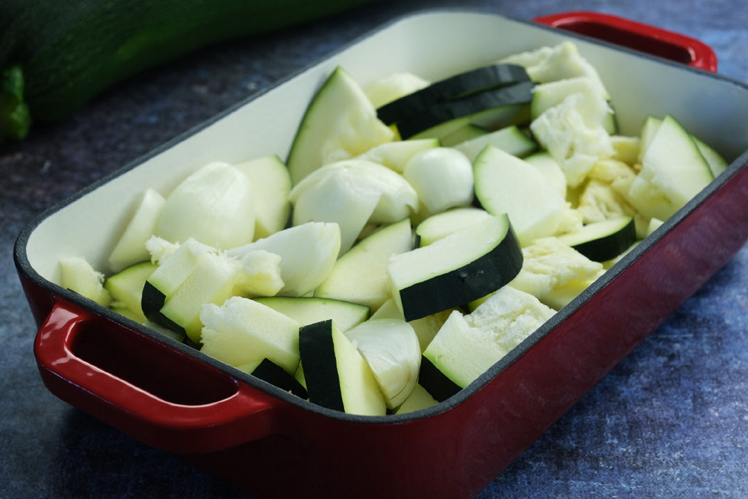 Enameled cast iron coasting pan baking dish from Crucible Cookware with zucchini and onion