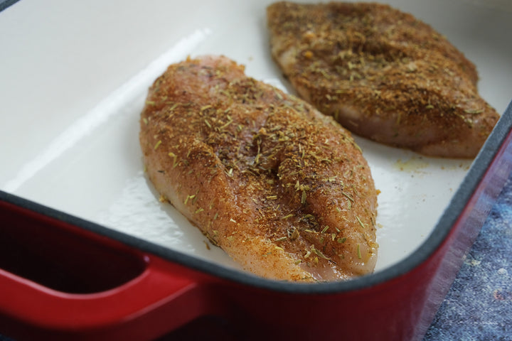 Enameled cast iron coasting pan baking dish from Crucible Cookware with chicken fillets