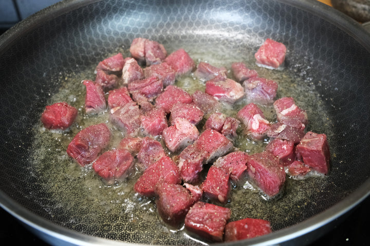 sauteing sirloin steak in a hybrid stainless steel nonstick frying pan