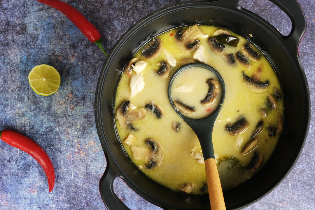 soup in an Enameled cast iron balti dish with glass lid