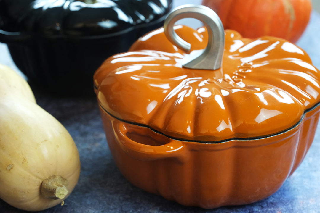 Enameled Cast Iron Pumpkin Pot in orange on the table