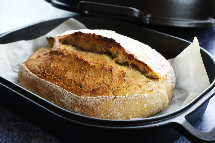 Extra large cast iron bread pan with lid with sourdough bread