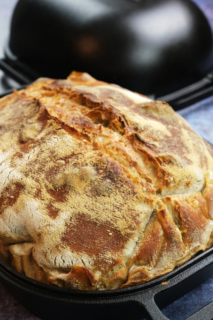 cast iron bread pan with lid with sourdough vertical